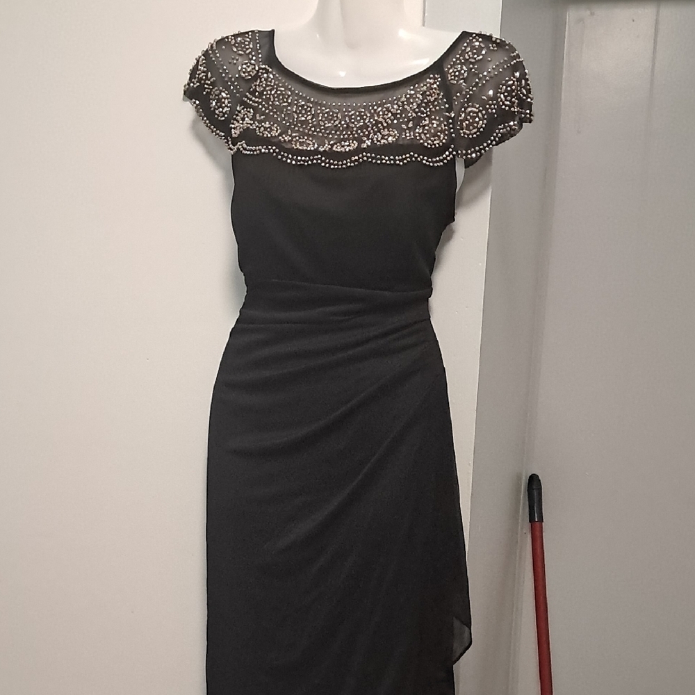 Elegant Black Dress with Embellished Neckline